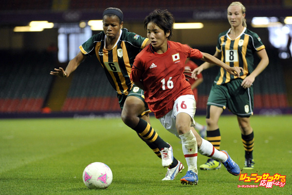 CARDIFF, WALES - JULY 31: Zamandozi Cele of South Africa challenges Asuna Tanaka of Japan during the Women's Football first round Group F Match between Japan and South Africa, on Day 4 of the London 2012 Olympic Games at Millennium Stadium on July 31, 2012 in Cardiff, Wales.  (Photo by Francis Bompard/Getty Images)