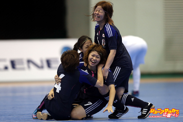 INCHEON, SOUTH KOREA - JULY 05:  Chikage Kichibayashi #7 of Japan (C) is congratulated by team mates after scoring a goal against Iran during the Women's Futsal Gold Medal match at Songdo Global University Campus Gymnasium during day seven of the 4th Asian Indoor & Martial Arts Games on July 5, 2013 in Incheon, South Korea.  (Photo by Chris McGrath/Getty Images)