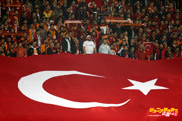 ISTANBUL, TURKEY - DECEMBER: Fans carry Turkish national flag during the Turkish Spor Toto Super Lig football match between Galatasaray and Gaziantepspor at TT Arena in Istanbul, Turkey on December 11, 2016.   (Photo by Berk Ozkan/Anadolu Agency/Getty Images)