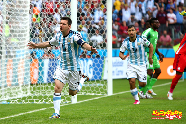 PORTO ALEGRE, BRAZIL - JUNE 25:  Lionel Messi of Argentina celebrates scoring his team's first goal during the 2014 FIFA World Cup Brazil Group F match between Nigeria and Argentina at Estadio Beira-Rio on June 25, 2014 in Porto Alegre, Brazil.  (Photo by Alex Grimm - FIFA/FIFA via Getty Images)