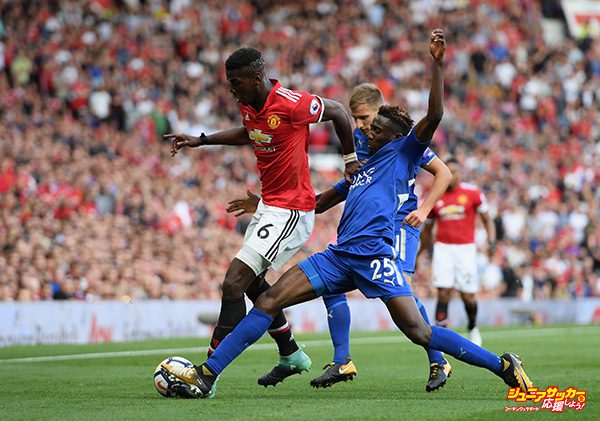 MANCHESTER, ENGLAND - AUGUST 26: Paul Pogba of Manchester United and Wilfred Ndidi of Leicester City battle for possession during the Premier League match between Manchester United and Leicester City at Old Trafford on August 26, 2017 in Manchester, England.  (Photo by Ross Kinnaird/Getty Images)