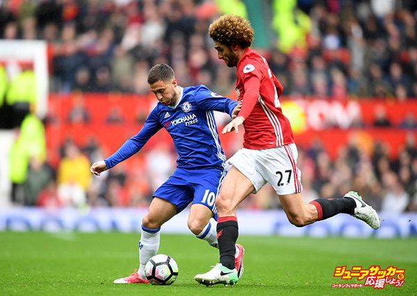 MANCHESTER, ENGLAND - APRIL 16: Eden Hazard of Chelsea attempts to take the ball past Marouane Fellaini of Manchester United during the Premier League match between Manchester United and Chelsea at Old Trafford on April 16, 2017 in Manchester, England.  (Photo by Michael Regan/Getty Images)