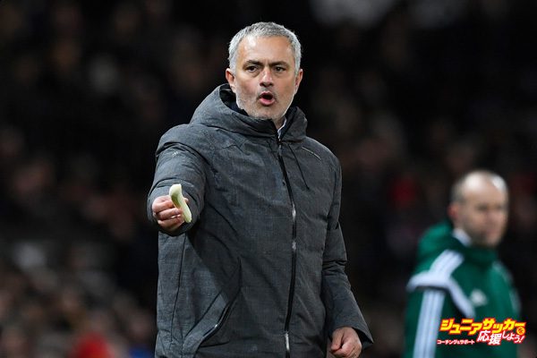 MANCHESTER, ENGLAND - MARCH 16:  Jose Mourinho, Manager of Manchester United attempts to get a a banana to Marcos Rojo of Manchester United during the UEFA Europa League Round of 16, second leg match between Manchester United and FK Rostov at Old Trafford on March 16, 2017 in Manchester, United Kingdom.  (Photo by Stu Forster/Getty Images)