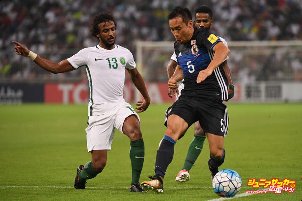 JEDDAH, SAUDI ARABIA - SEPTEMBER 05:  Yuto Nagatomo of Japan and Yasser Al-Shahrani of Saudi Arabia compete for the ball during the FIFA World Cup qualifier match between Saudi Arabia and Japan at the King Abdullah Sports City on September 5, 2017 in Jeddah, Saudi Arabia.  (Photo by Kaz Photography/Getty Images)